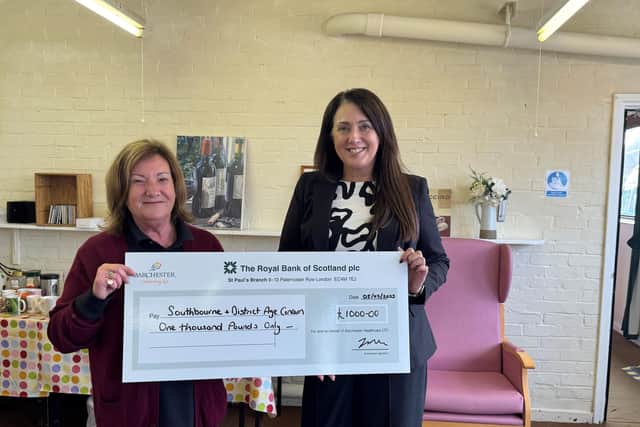 GM Sarah presenting the cheque