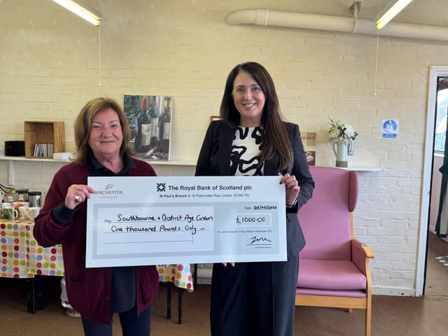 GM Sarah presenting the cheque