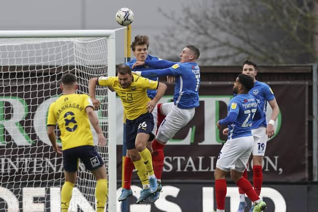 Sean Raggett and Ronan Curtis help snuff out yet another Oxford United attack as the 10 men battled valiantly in Saturday's 3-2 defeat. Picture: Jason Brown/ProSportsImages