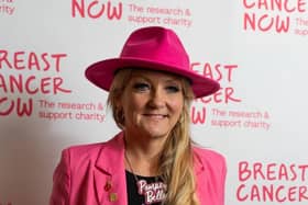 Amanda Martin MP wearing the breast cancer care hat.