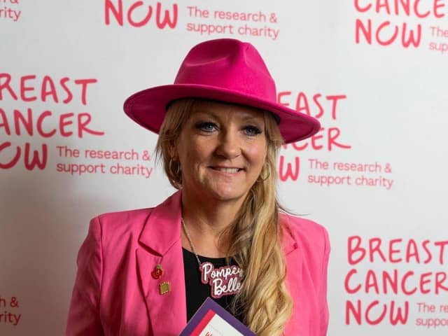 Amanda Martin MP wearing the breast cancer care hat.