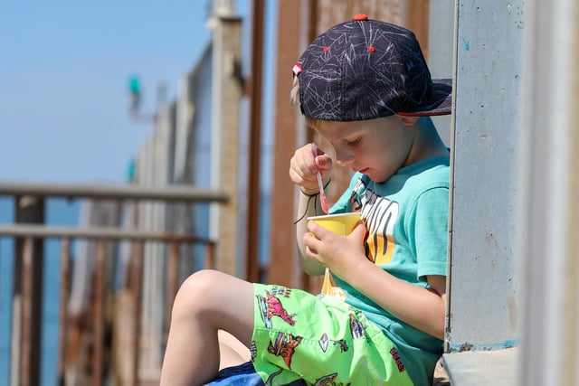 Greyson Perren-Barnes (four) enjoying a nice ice cream in the sun. Picture: Alex Shute
