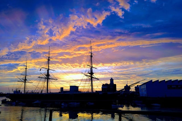 The sun setting over Portsmouth Historic Dockyard. Credit: Nick Bates.