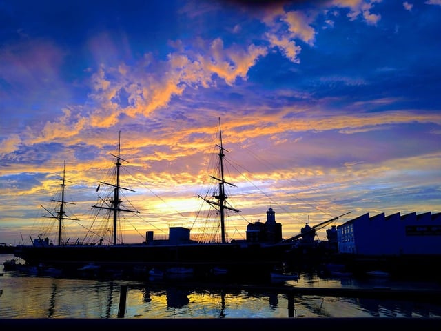 The sun setting over Portsmouth Historic Dockyard. Credit: Nick Bates.