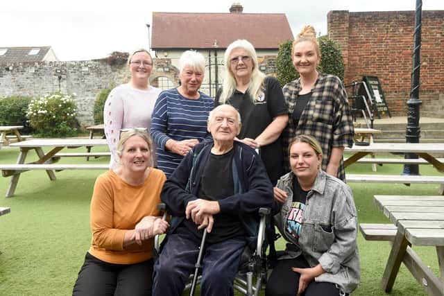 Albert Green known as "Jimmy" from Drayton, turned 100 on Saturday, October 1, and celebrated with his son Peter Green and his friends from the United Reformed Church coffee club, at The Sunshine Inn pub in Drayton.Pictured is: Jimmy Green with staff from The Sunshine Inn (back l-r) Sam Harris, Mariane Simpson, Kath Proietti and Charlene Howlett with (front right) Tara Smith and (left) Alison Keoghan who helps out at the United Reformed Church coffee club.Picture: Sarah Standing (290922-3984)