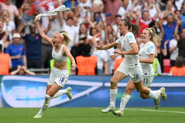 Chloe Kelly celebrates with team mates after scoring England's Euro 2022 winner against Germany at Wembley. Photo by Shaun Botterill/Getty Images