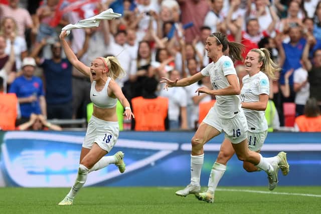 Chloe Kelly celebrates with team mates after scoring England's Euro 2022 winner against Germany at Wembley. Photo by Shaun Botterill/Getty Images