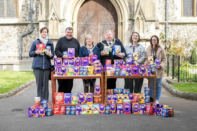 St Marys has launched a Signs of Hope and Life appeal, handing Easter eggs and gardening equipment to Portsmouth charities the Roberts Centre and Stop Domestic Abuse on Monday April 11, 2022. Pictured: Donna Burney of Roberts Centre, Father Bob White, Moyoress Mrs Joy Maddox, Lord Mayor Frank Jonas and Emily Price and Charlotte Ferguson of STOP Domestic Abuse outside St Marys church, Fratton, Portsmouth with the donated Easter eggs. Picture: Habibur Rahman