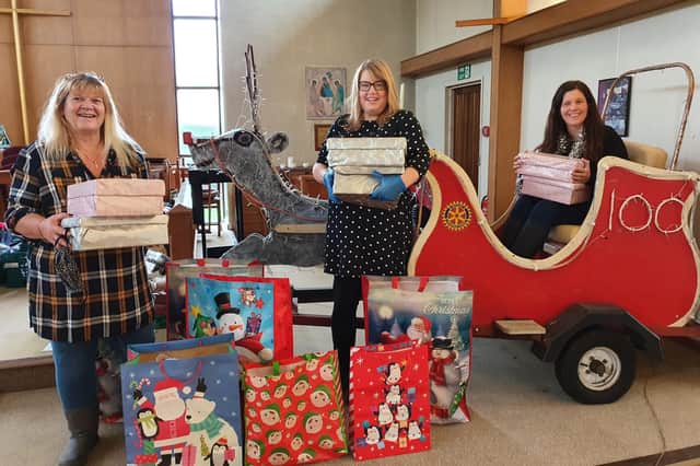 Acts of Kindness setting up for Santa's visit. Left to right: Fiona Hampson and Lorraine Parker from Gosport Stoke Road Sisters WI and Kerry Snuggs from Acts of Kindness