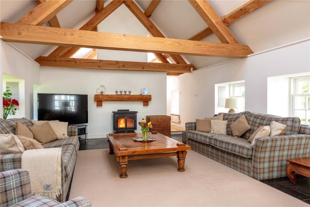 The open plan sitting room benefits from the sun room on one side and clever use of roof lights and windows, the whole wing is flooded with natural light