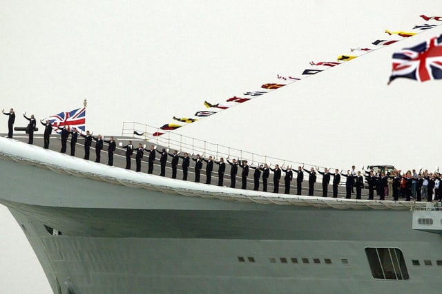 The crew of HMS Invincible salute as HMS Endurance carrying Britain's Queen Elizabeth II passes during the International Fleet Review at Spithead, off Portsmouth, Tuesday June 28, 2005.  A total of 167 ships from the Royal Navy and 35 nations are taking part in the International Fleet Review at Spithead, off Portsmouth, as part of the Trafalgar 200 celebrations this week. See PA Story SEA Trafalgar. PRESS ASSOCIATION Photo. Photo credit should read: Gareth Fuller/PA 