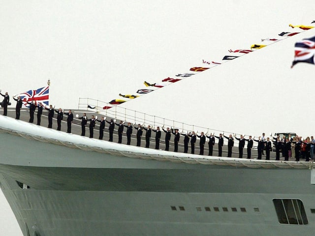 The crew of HMS Invincible salute as HMS Endurance carrying Britain's Queen Elizabeth II passes during the International Fleet Review at Spithead, off Portsmouth, Tuesday June 28, 2005. A total of 167 ships from the Royal Navy and 35 nations are taking part in the International Fleet Review at Spithead, off Portsmouth, as part of the Trafalgar 200 celebrations this week. See PA Story SEA Trafalgar. PRESS ASSOCIATION Photo. Photo credit should read: Gareth Fuller/PA