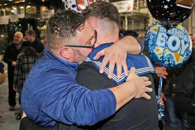Able Seaman Rhys Zanetti got a big surprise for his 18th birthday on board HMS Prince of Wales – when his family sneaked on board to present him with a birthday cake. Photo: Royal Navy