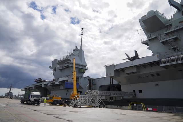HMS Queen Elizabeth at HM Naval Base, Portsmouth, ahead of the ship's maiden deployment to lead the UK Carrier Strike Group on a 28-week operational deployment travelling over 26,000 nautical miles from the Mediterranean to the Philippine Sea. Picture date: Saturday May 22, 2021.
