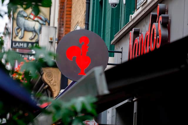 Nando's is reopening six restaurants for delivery only. Picture: TOLGA AKMEN/AFP via Getty Images