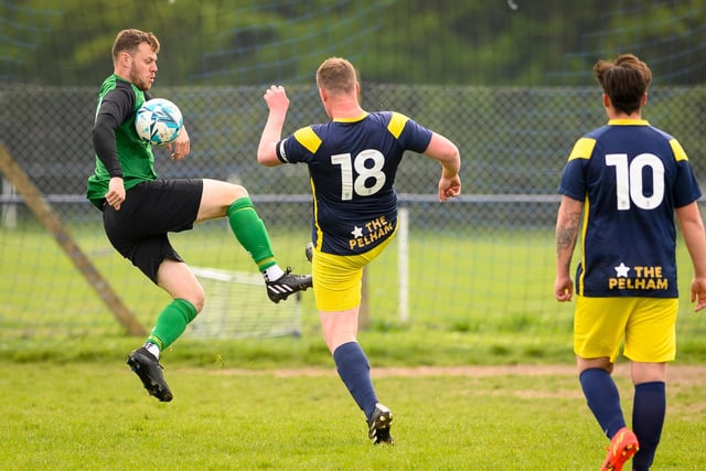 Action from Saturn Royale's 1-0 win over Pelham Arms (blue and yellow kit) in the second Adelaide Cup semi-final. Picture: Keith Woodland (300421-25)