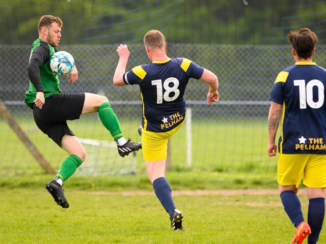 Action from Saturn Royale's 1-0 win over Pelham Arms (blue and yellow kit) in the second Adelaide Cup semi-final. Picture: Keith Woodland (300421-25)