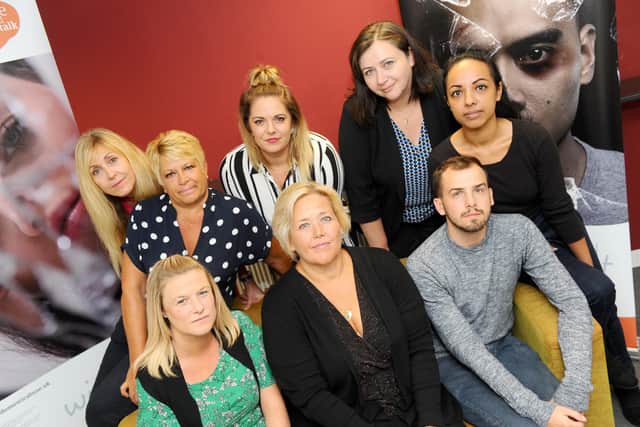 Pictured before Covid-19 is: (back l-r) Nikki Day, senior independent domestic violence advisor, Sue Harrower, service manager, Rachel Windebank, operations director, Jo Eamey, business support and development director and Helin Khan, community development worker, with (front l-r) Becky Roper, outreach adults project worker, Claire Lambon, CEO, and Marcus Ward, childrens and young person worker. 

Picture: Sarah Standing (021019-7904)