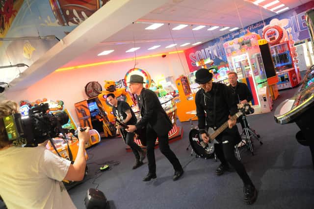Punk band The Professionals playing their song Twenty Twenty Vision in the amusement arcade on South Parade Pier. Picture by Paul Windsor