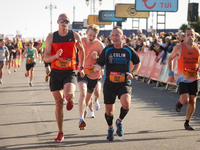 Pictured is: Runners cross the line to finish
Picture: Keith Woodland (151021-646)