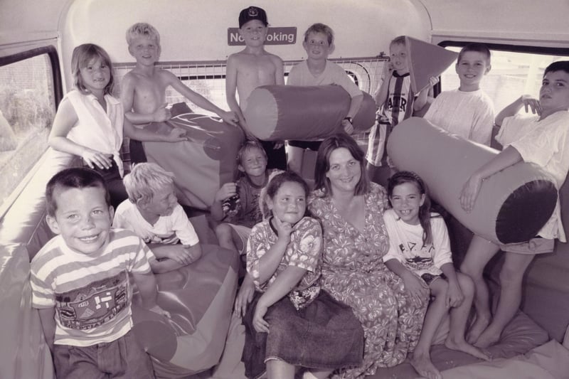 Children in the soft-shapes play area on the Replay double decker bus at its firt stop at Broadlaw Walk shopping centre at Bishopsfield Road, Fareham with worker Jane Miller in July 1995. The News PP1064