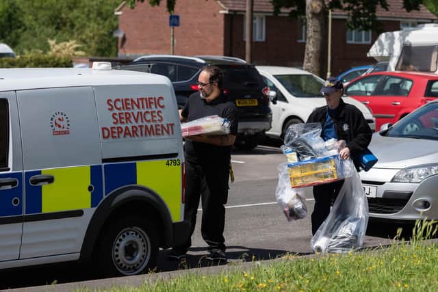 Officers carry out bagged items from a property in Leigh Park, after a body was found in woodlands during the search for missing 16 year-old Louise Smith. Picture: Jordan Pettitt/Solent News & Photo Agency