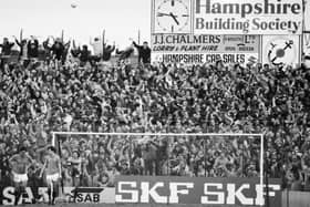 Fans in the terraces watching a Portsmouth v Southampton match at Fratton Park, Portsmouth, UK, 30th January 1984. (Photo by Reg Lancaster/Daily Express/Hulton Archive/Getty Images)