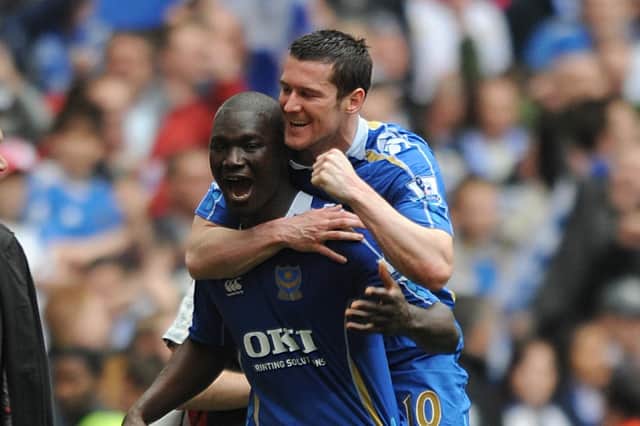 Papa Bouba Diop celebrates Pompey's 2008 FA Cup win with team-mate David Nugent