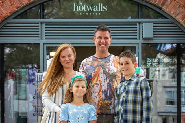James Mouland, 46, and Bahar Mouland, 43, outside their Hotwalls Studio 13, with children Melodi, seven, and Baris, 10 Picture: Mike Cooter (060821)