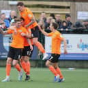 Dean Beckwith, left, celebrates his last-gasp winner at Dorking. Picture: Kieron Louloudis