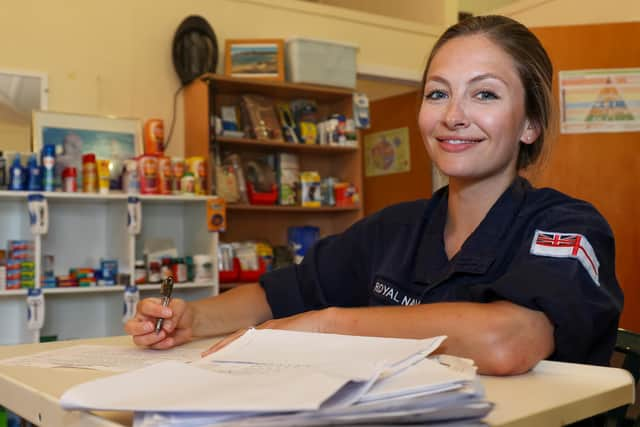 Surgeon Lieutenant Karolyn John finishes administration after four days of clinical work.