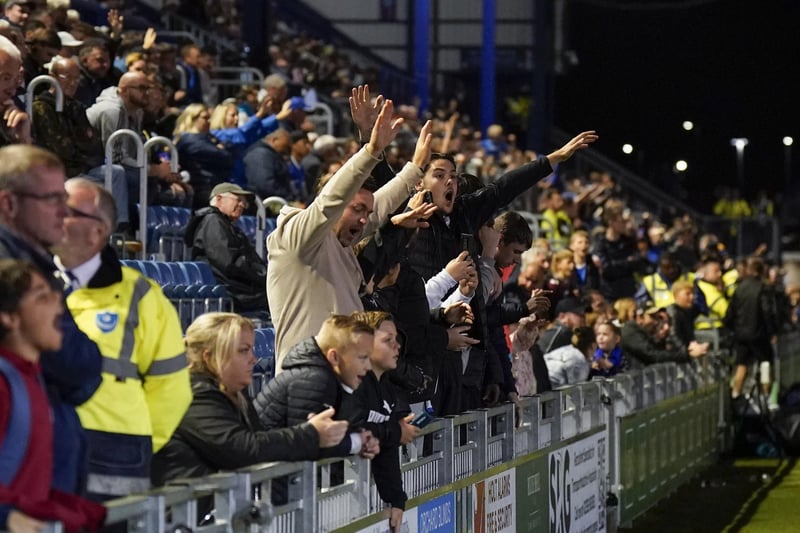 Pompey fans under the lights against Peterborough in the Carabao Cup.