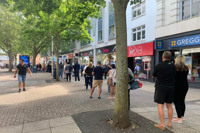 Shoppers queue for Sports Direct in Commercial Road. Picture: Sarah Standing