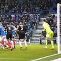 Bobby Thomas heads home Barry Cotter's long throw-in on 89 minutes as Barnsley snatch a late 1-1 draw against Pompey. Picture: Barry Zee