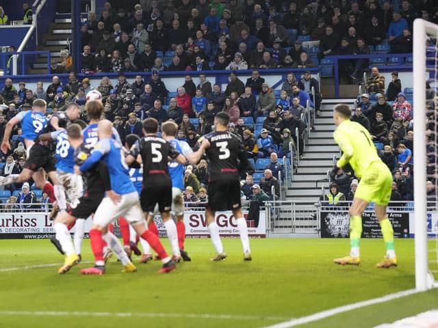 Bobby Thomas heads home Barry Cotter's long throw-in on 89 minutes as Barnsley snatch a late 1-1 draw against Pompey. Picture: Barry Zee