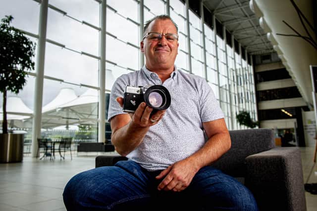 Kevin Hooper taking a reading from a camera 
Picture: Habibur Rahman