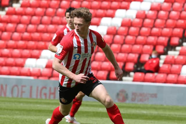 SUNDERLAND, ENGLAND - MAY 09: Denver Hume of Sunderland in action during the Sky Bet League One match between Sunderland and Northampton Town at Stadium of Light on May 09, 2021 in Sunderland, England. (Photo by Pete Norton/Getty Images)