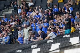 These travelling fans make themsevles heard during Pompey's 1-1 draw against MK Dons.