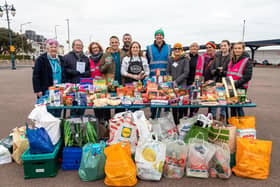 The 'phenomenal donation' of food by Southsea Parkrunners to the food bank at St. Margaret's Church. Pictured: Angela Horlock, Steve Hayward, Debs Smart, Fran Carabott, Stuart Horlock, St Margaret's food bank Coordinator Lauren Proughton (centre), Run Director Stephen Rose, Brenda Meves, Project Initiator Eileen Kenyon, two volunteers and Event Director Emma Cardey. Picture: Mike Cooter (040223)