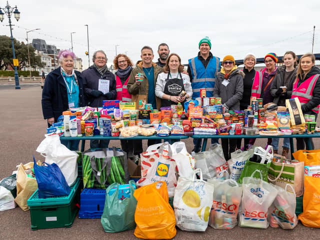 The 'phenomenal donation' of food by Southsea Parkrunners to the food bank at St. Margaret's Church. Pictured: Angela Horlock, Steve Hayward, Debs Smart, Fran Carabott, Stuart Horlock, St Margaret's food bank Coordinator Lauren Proughton (centre), Run Director Stephen Rose, Brenda Meves, Project Initiator Eileen Kenyon, two volunteers and Event Director Emma Cardey. Picture: Mike Cooter (040223)