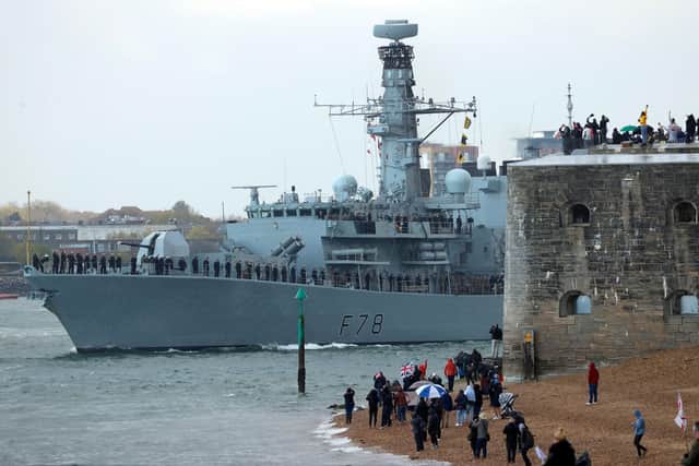 People wave from the shore as HMS Kent, a Type 23 frigate, leaves Portsmouth Naval Base on the south coast of England, on May 1, 2021 (Photo by Adrian DENNIS / AFP) (Photo by ADRIAN DENNIS/AFP via Getty Images)
