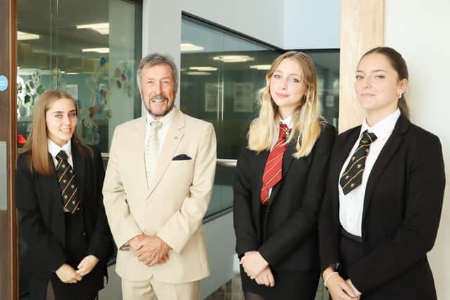 Businessman Brian Wilkie MBE at the opening of the new sixth form library at Portsmouth Grammar School, with the latest Wilkie Scholars from Mayfield School, Lizzie, Emily and Katie.