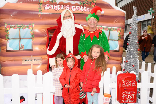Pictured is: Santa and his helper with Cally Rose, Ellis Eastward-Freeman and Emilia Busby-Currey

Picture: Keith Woodland (031221-19)