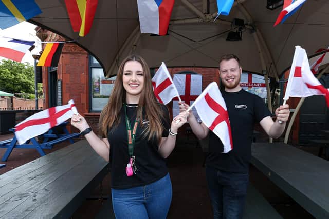 Supervisor Kara Horsburgh and general manager Lawrence Hall get behind England at The Shepherds Crook pub, Fratton, for Euro 2020
Picture: Chris Moorhouse (jpns 110621-45)