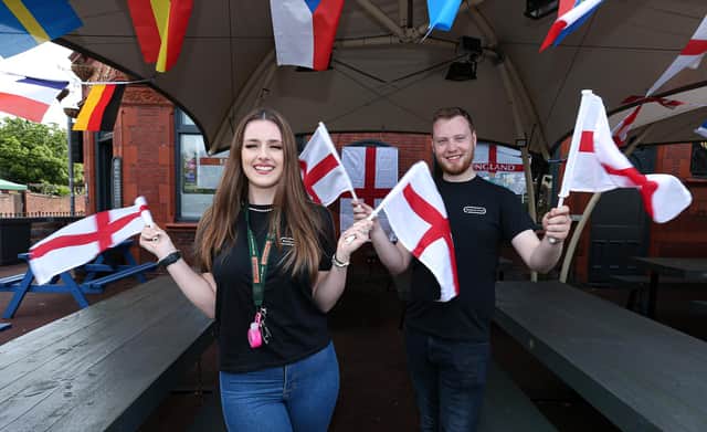 Supervisor Kara Horsburgh and general manager Lawrence Hall get behind England at The Shepherds Crook pub, Fratton, for Euro 2020Picture: Chris Moorhouse (jpns 110621-45)