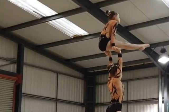 Gymnasts at the Eclipse Gymnastics Community Interest Club practise one of their routines.