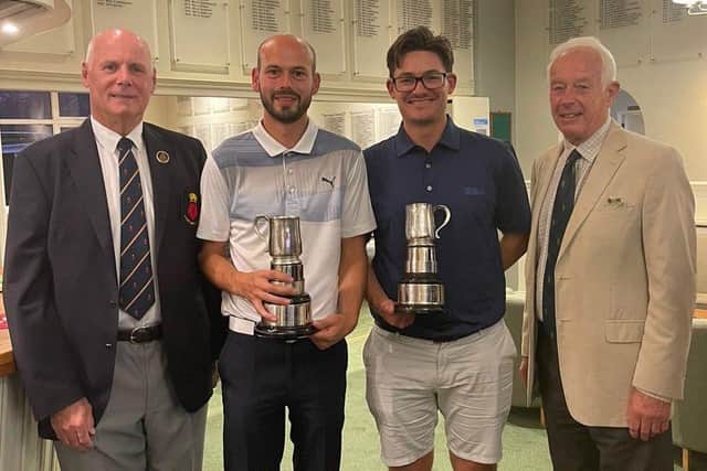 Richard Harris (centre left) and Joe Foster receive their County Foursomes trophies from Hampshire Golf president Alan Drayton (left). Pic: Andrew Griffin.