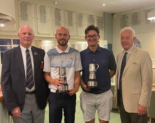 Richard Harris (centre left) and Joe Foster receive their County Foursomes trophies from Hampshire Golf president Alan Drayton (left). Pic: Andrew Griffin.