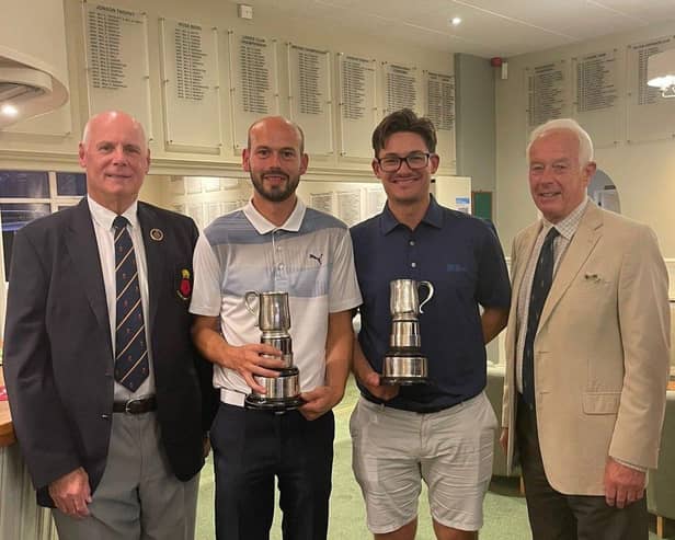 Richard Harris (centre left) and Joe Foster receive their County Foursomes trophies from Hampshire Golf president Alan Drayton (left). Pic: Andrew Griffin.
