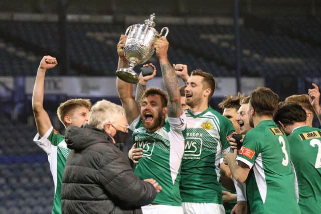 Moneyfields lift the delayed 2019/20 Portsmouth Senior Cup trophy at Fratton Park last May. Picture: Chris Moorhouse